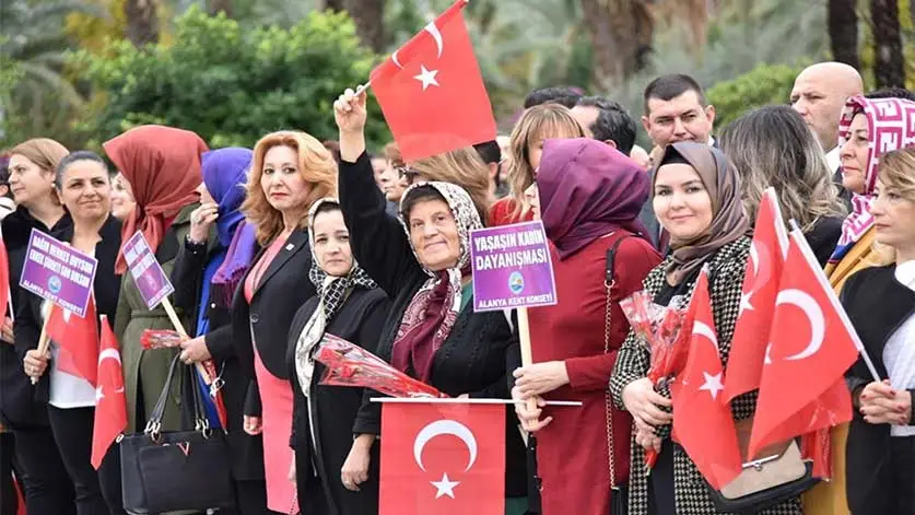 Women in hijab or not protesting using Turkey flag