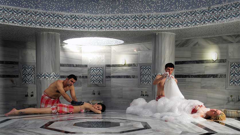 Tilaks foaming two ladies in a Turkish bath