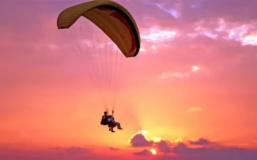 Paragliding in Kas sky in the sunset